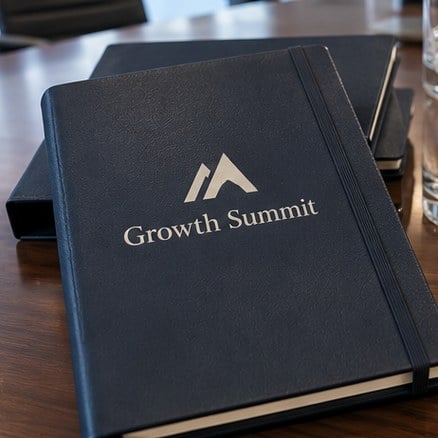 Customized brand planners at a conference table