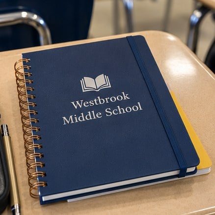 Customized student planners on a school desk